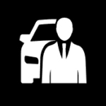 White icon of a person in a suit standing in front of a car on a black background, representing a chauffeur or professional driver service.