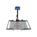 A metal wheelchair lift platform with a perforated surface, black frame, and a vertical support post featuring a blue control box at the top.