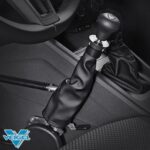 Close-up of a cars hand control system for drivers with disabilities, showing a modified gear lever covered in black leather, with the Veigel logo in the corner.