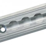 Close-up of a silver metal linear rail with evenly spaced circular indentations and two screw holes at each end, used for guiding mechanical motion in machinery or automation systems.