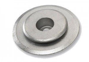 A metal washer with a central hole and a slightly raised inner ring, often used in mechanical assemblies to distribute the load of a threaded fastener.